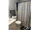 Bathroom with a shower/tub combo and geometric shower curtain at 112 Jennifer Sw Ln, Marietta, GA 30060