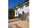 Front view of a two-story house with stairs and landscaping at 112 Jennifer Sw Ln, Marietta, GA 30060