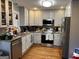 Modern kitchen with stainless steel appliances and granite countertops at 112 Jennifer Sw Ln, Marietta, GA 30060