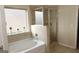 Bathroom with a soaking tub and separate shower at 12298 Centerra Dr, Hampton, GA 30228