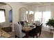 Formal dining room featuring a marble top table and chandelier at 12298 Centerra Dr, Hampton, GA 30228