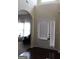 Bright entryway with hardwood floors and view into living room at 12298 Centerra Dr, Hampton, GA 30228