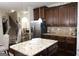 Island kitchen with granite countertops and stainless steel appliances at 12298 Centerra Dr, Hampton, GA 30228