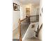 Upper hallway with laundry and access to bedrooms at 12298 Centerra Dr, Hampton, GA 30228