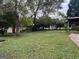 Large backyard with a storage shed and established trees at 5157 West Nw St, Covington, GA 30014