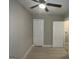 Bedroom with hardwood floors, ceiling fan and doors at 5157 West Nw St, Covington, GA 30014