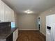 Simple dining area with wood-look floors and access to kitchen at 5157 West Nw St, Covington, GA 30014