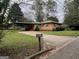 Ranch style home with carport, mature trees, and a spacious yard at 5157 West Nw St, Covington, GA 30014