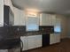 Updated kitchen, featuring white cabinets and modern sink at 5157 West Nw St, Covington, GA 30014