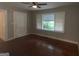 Bright living room with hardwood floors and large windows at 5157 West Nw St, Covington, GA 30014