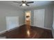 Living room with hardwood floors, fireplace, and view to kitchen at 5157 West Nw St, Covington, GA 30014