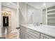 Modern bathroom with gray vanity, white countertop, and built-in shelving at 3199 Mcafee Rd, Decatur, GA 30032