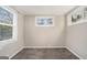 Simple bedroom with neutral walls and carpet flooring at 3199 Mcafee Rd, Decatur, GA 30032