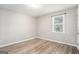 Simple bedroom with hardwood floors and a window with blinds at 3199 Mcafee Rd, Decatur, GA 30032
