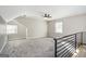 Large bedroom with gray carpeting, ceiling fan, and a loft-style area at 3199 Mcafee Rd, Decatur, GA 30032