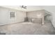 Spacious bedroom with gray carpet, a window, and a loft view at 3199 Mcafee Rd, Decatur, GA 30032