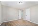 Spacious bedroom with hardwood floors and access to other rooms at 3199 Mcafee Rd, Decatur, GA 30032