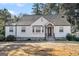 Charming white brick ranch house with a well-manicured lawn at 3199 Mcafee Rd, Decatur, GA 30032