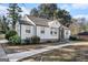 White brick ranch house with a spacious front yard and walkway at 3199 Mcafee Rd, Decatur, GA 30032