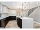 Updated kitchen featuring an island and stylish light fixtures at 3199 Mcafee Rd, Decatur, GA 30032