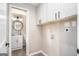 Laundry room with upper cabinets and space for a full-size washer and dryer at 3199 Mcafee Rd, Decatur, GA 30032