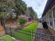 Artificial turf backyard with a black metal fence at 511 Bonneset Ct, Canton, GA 30114