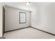 Neutral bedroom features plush carpet, a window with blinds, and ample natural light at 5427 Forest Pines Dr, Lithonia, GA 30058