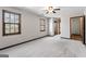 Spacious main bedroom with plush carpet, natural light, and dual closets at 5427 Forest Pines Dr, Lithonia, GA 30058