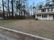 The front yard is expansive and ready for landscaping at 5427 Forest Pines Dr, Lithonia, GA 30058