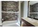 Updated bathroom with dark tile and vanity at 5173 Kingswood Cir, Atlanta, GA 30349