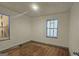 Bright bedroom with hardwood floors and windows at 5173 Kingswood Cir, Atlanta, GA 30349