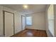 Spacious bedroom with hardwood floors and two windows at 5173 Kingswood Cir, Atlanta, GA 30349