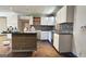 Kitchen with white cabinets, granite countertops, and island at 5173 Kingswood Cir, Atlanta, GA 30349