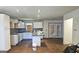 Kitchen with white cabinets, granite countertops, and tile floor at 5173 Kingswood Cir, Atlanta, GA 30349