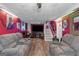 Finished basement with sectional sofas and a large TV at 100 Traverse Ct, Atlanta, GA 30349