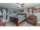 Spacious bedroom with a king-size bed and ceiling fan at 100 Traverse Ct, College Park, GA 30349