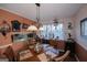 Bright dining room with wood table and chairs, plus a view of the kitchen at 100 Traverse Ct, College Park, GA 30349