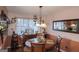 Charming dining room features a round table and decorative wall mirror at 100 Traverse Ct, Atlanta, GA 30349