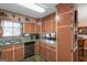 Kitchen with granite countertops, light brown cabinets, and stainless steel appliances at 100 Traverse Ct, Atlanta, GA 30349