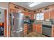 Updated kitchen featuring stainless steel appliances and orange cabinets at 100 Traverse Ct, Atlanta, GA 30349