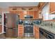 Modern kitchen with stainless steel appliances and granite countertops at 100 Traverse Ct, College Park, GA 30349