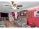 Spacious living room featuring a gray couch and red walls at 100 Traverse Ct, College Park, GA 30349