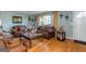 Living room with hardwood floors, brown leather couches, and decorative accents at 100 Traverse Ct, Atlanta, GA 30349