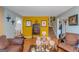 Living room with hardwood floors, brown leather couches, and decorative accents at 100 Traverse Ct, Atlanta, GA 30349