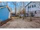 Side yard with trees and a gate at 100 Traverse Ct, Atlanta, GA 30349