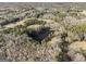 Aerial photo of property with a pond and open fields at 255 Barnett Road Rd, Hampton, GA 30228