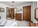 Bedroom featuring a neutral color scheme, open doorway to the bathroom, and a closet door for storage at 255 Barnett Road Rd, Hampton, GA 30228