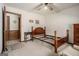 Bedroom with bare frame, dresser, and doorway to connecting room at 255 Barnett Road Rd, Hampton, GA 30228