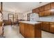 Kitchen with wood cabinets and an island at 255 Barnett Road Rd, Hampton, GA 30228