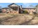 Back of the house with screened porch and brick chimney at 255 Barnett Road Rd, Hampton, GA 30228